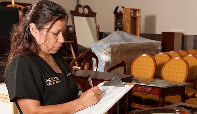 Professional worker  checking items in storage