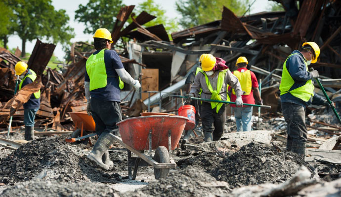 a team is restoring a disaster damaged area
