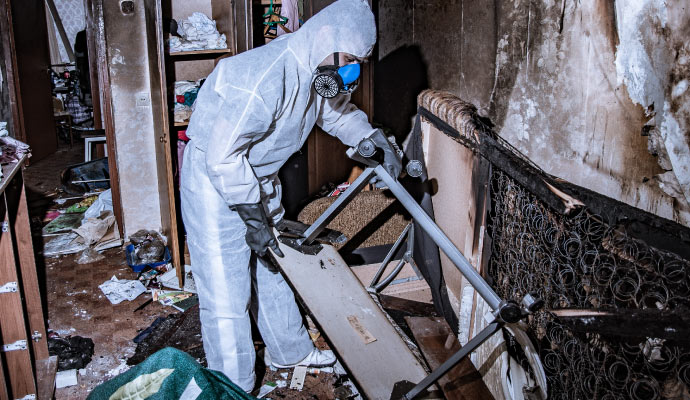 A person is restoring a fire damaged house